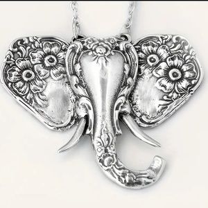 Silver colored elephant head necklace  NIP. Scrollwork detail. 17.3”+2 chain